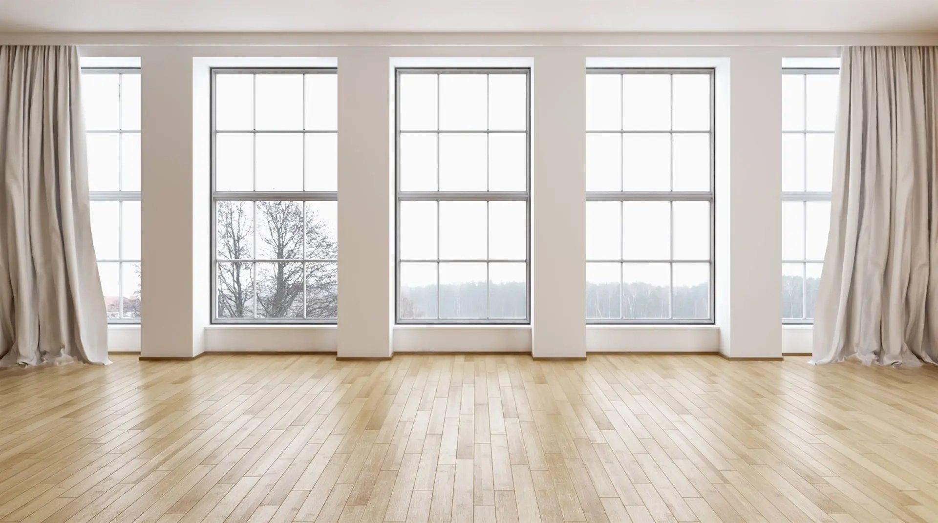 Sunlit room lined with tall replacement windows