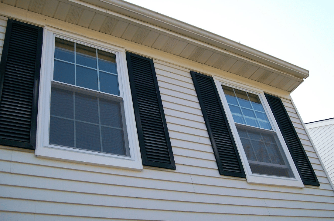 exterior windows with black shutters