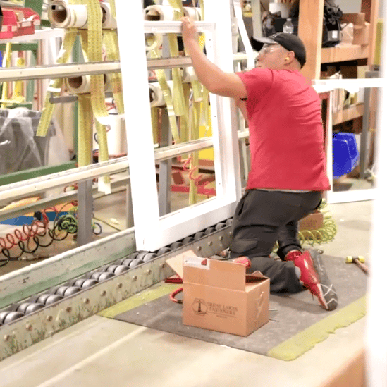 employee working on window 