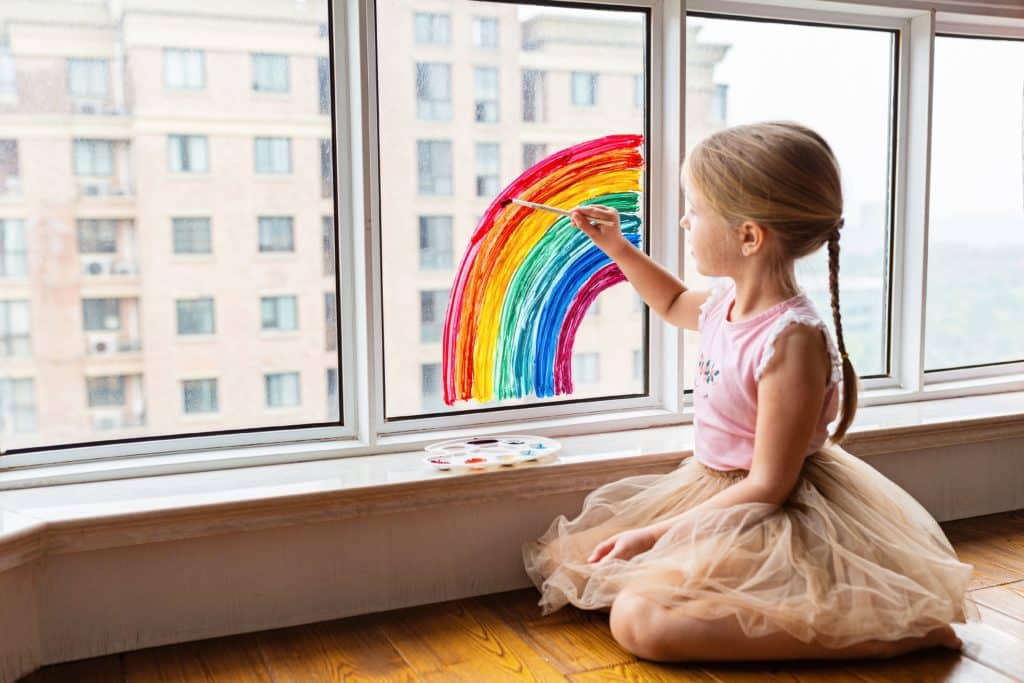 girl painting window in your home